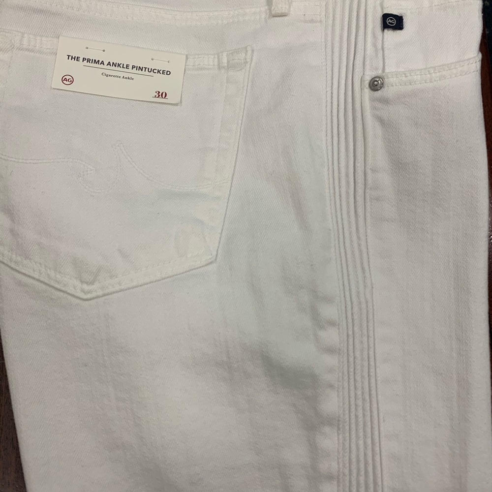 pair of white jeans by Adrian Goldschmied